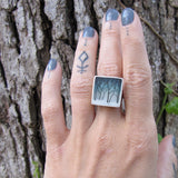 Model wearing forest ring